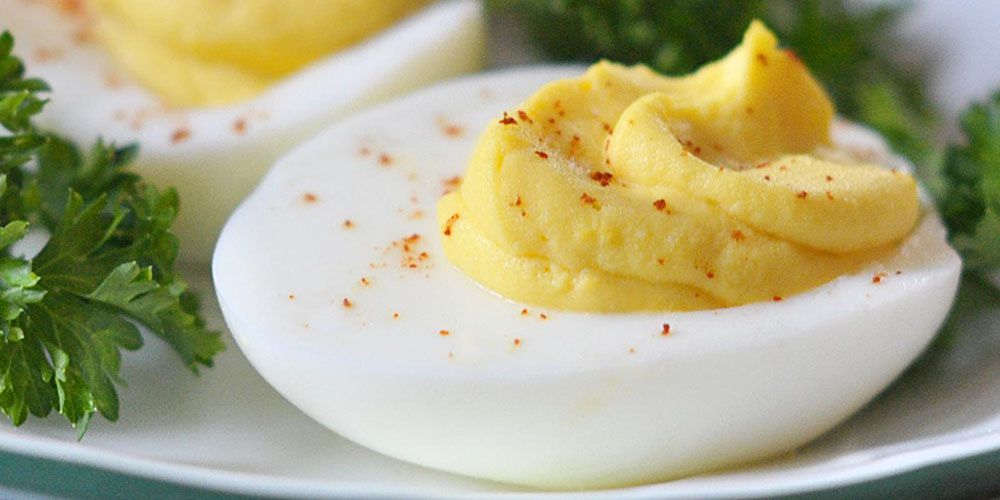 Deviled eggs garnished with parsley – a classic and easy appetizer recipe for gatherings and parties.